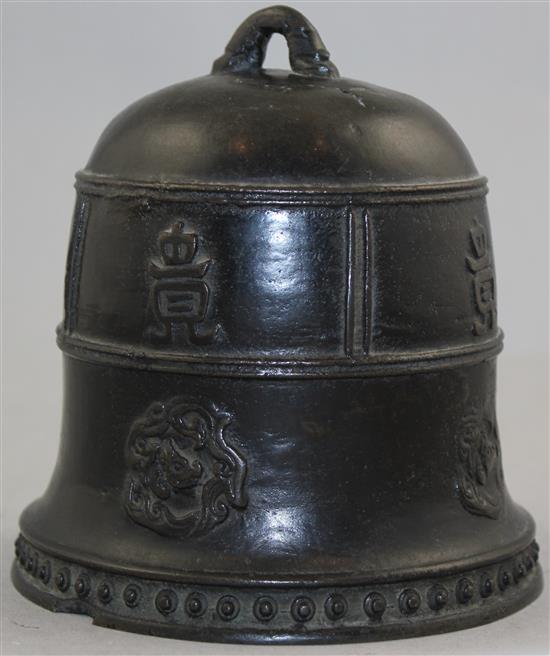 A Chinese or Japanese bronze small temple bell, 14cm